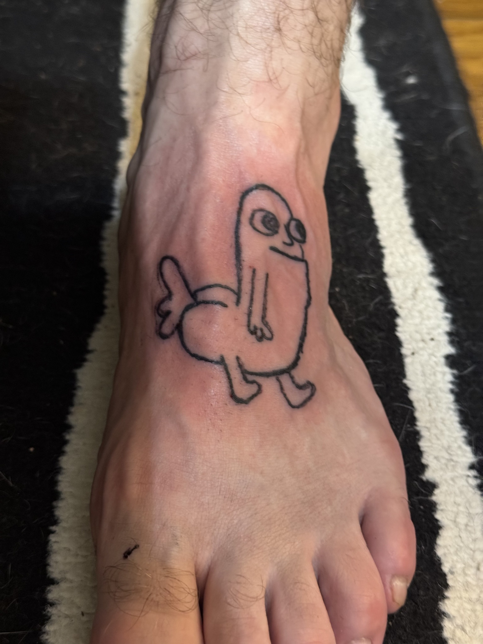 We had a cookout and my partner tattooed dickbutt on their foot - Imgur.jpg